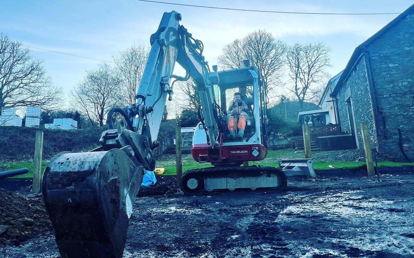 LEWZ Property Development Takeuchi mini-digger on a South Wales groundworks site preparing foundations